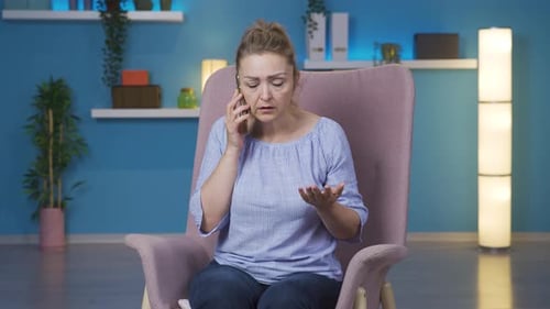 Woman talking on the phone arguing.