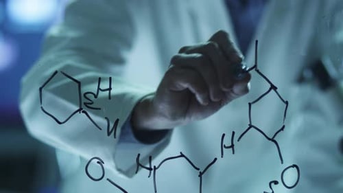 Scientist Writes Chemical Formulas on Glass Surface