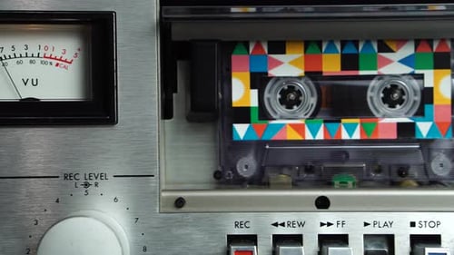 Vintage Audio Cassette Tape Playing in Deck With Analog VU Meters From 1980s