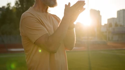 Caucasian Elderly Man Stretching Arms Hands Warm Up Exercises Sport Pensioner City Outdoors Sunrise