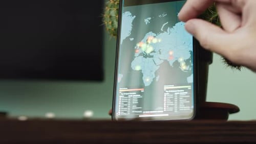 Smartphone Displaying World Map Being Used Indoors