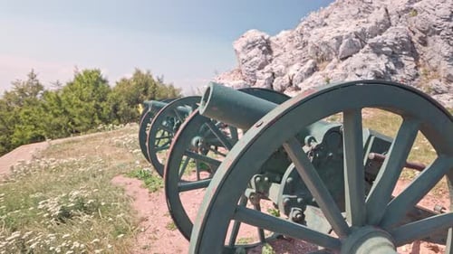 Bulgarian replica artillery cannons on rocky slope Shipka Battlefield
