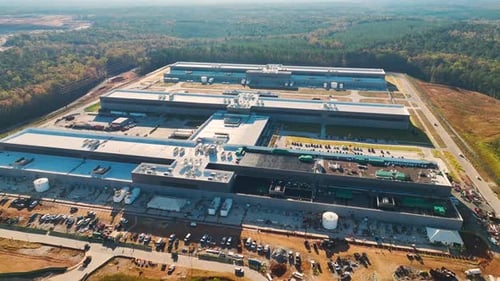 Top View of Large Building Site of New Factory Complex Under Construction