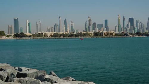 View Of Dubai Skyline From Rocky Nikki Beach Resort In Summer. wide shot