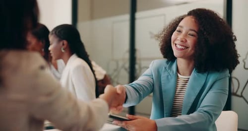 Handshake, discussion and business women in office with company merger, deal or partnership