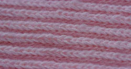 Extreme Close Up of Pink Knitted Fabric
