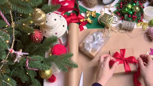Christmas Gifts Being Wrapped with Care at Home
