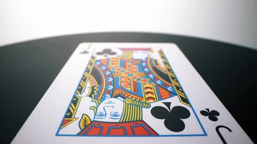 Close-Up of a Single Poker Card on Black Surface