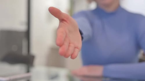 Close Up of Handshake offer by Female