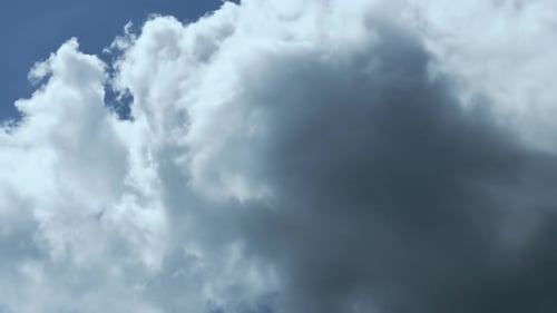 White Clouds Move Gently Across Blue Sky