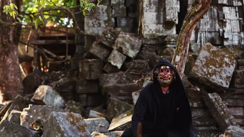 Masked Figure with Wooden Sword at Ancient Ruins
