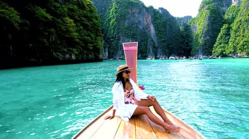 Pileh Lagoon with Green Emerald Ocean at Koh Phi Phi Thailand Women in Front of Longtail Boat