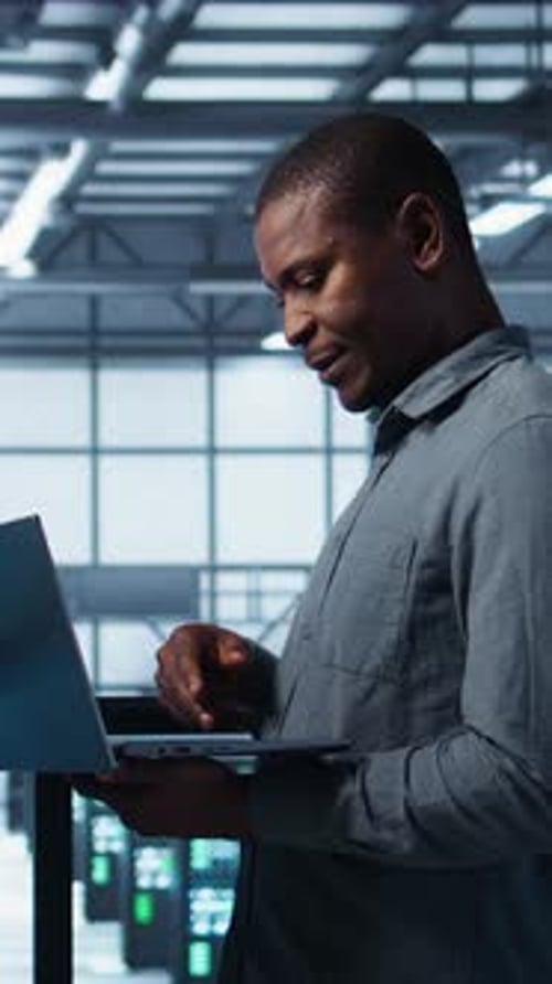 Vertical Video Server Farm Workers Using Devices to Perform Vulnerability Scans