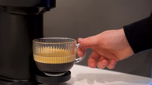 Grabbing a Cup of Coffee from Coffee Machine