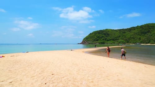 Tropical Beach Paradise with People Walking on Sandbar