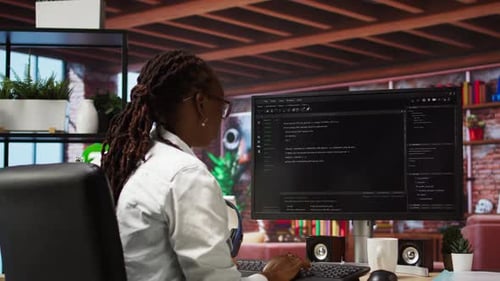 Programmer Types Code Into PC Entering Commands Running Script