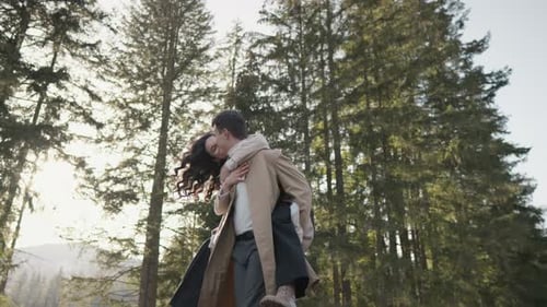 Young Couple on Walk in Park in the Spring