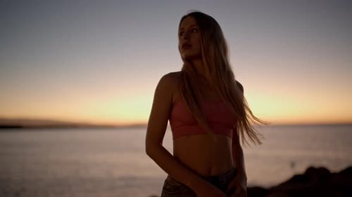 Woman at Sunrise By the Sea