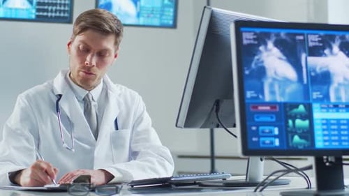 Professional Medical Doctor Working in Hospital Office Using Computer Technology Medicine Cardiology