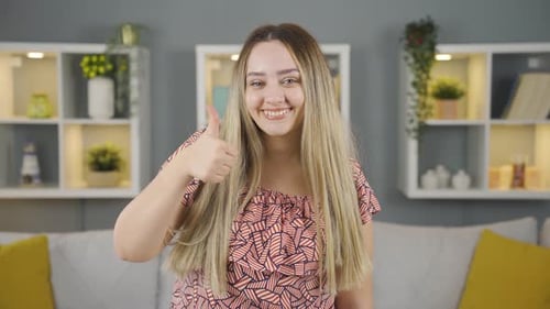 Blond Woman Gives Thumbs Up and Okay Sign