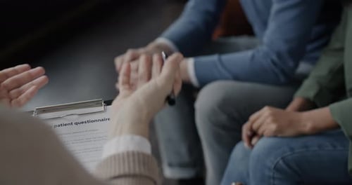 Couple Discussing Issues with Therapist During Therapy Session