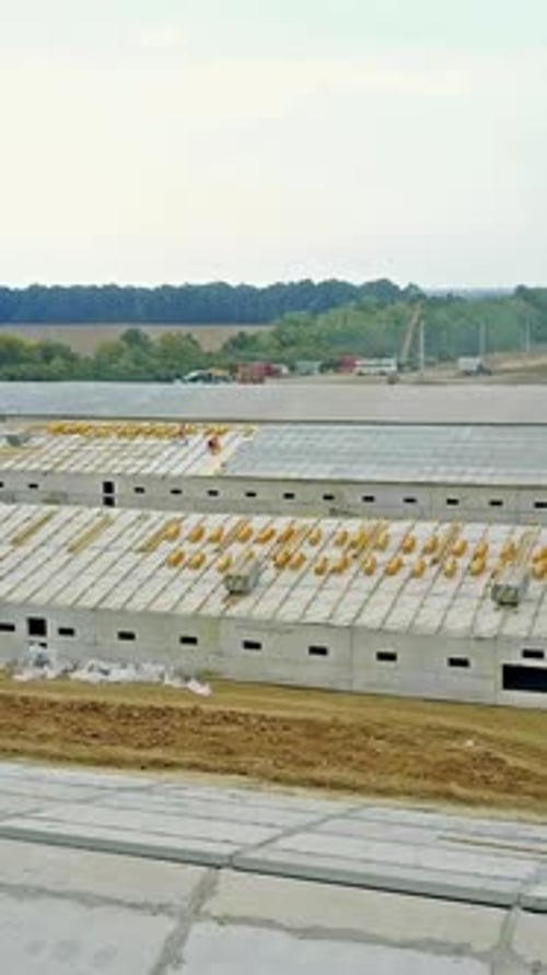 Constructing agriculture farm. Aerial view of construction site new farm for livestock