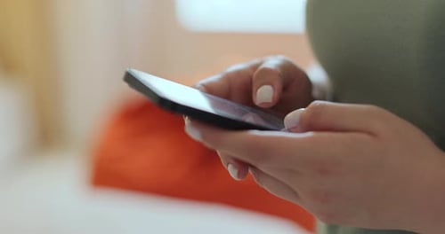 Woman Using Texting Mobile Phone or Chat in Home Morning Close Up of Young Woman Hand Technology