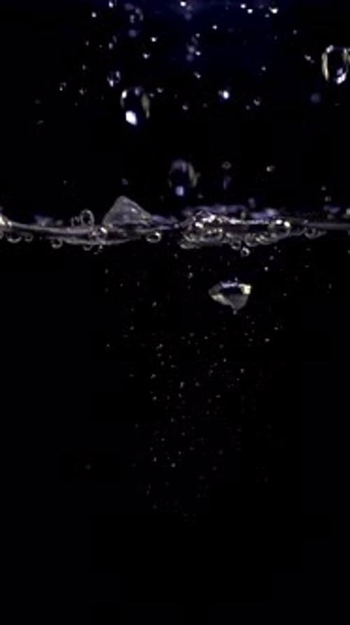 Water Drops Splashing Into a Body of Water