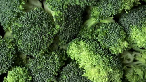 Broccoli slices rotating top view.