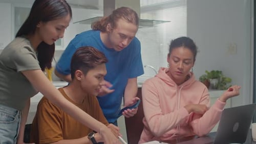 Young Adults Collaborating on School Assignment Together