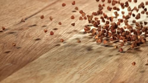 Buckwheat Falls on a Wooden Table Filmed on a Highspeed Camera at 1000 Fps