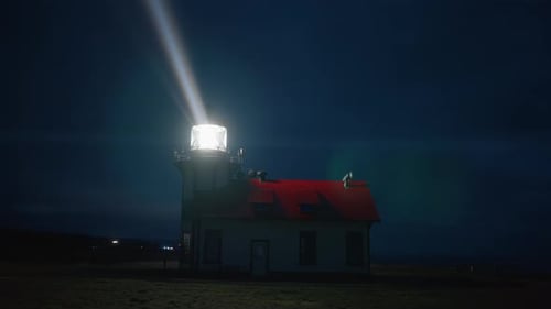 Lighthouse Beacon Shining Over Dark Ocean with Fog and Mist