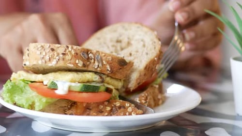 Cutting a Fresh Sandwich for Lunch