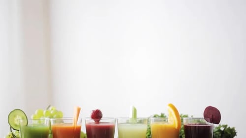 Colorful fruit and vegetable juices displayed indoors