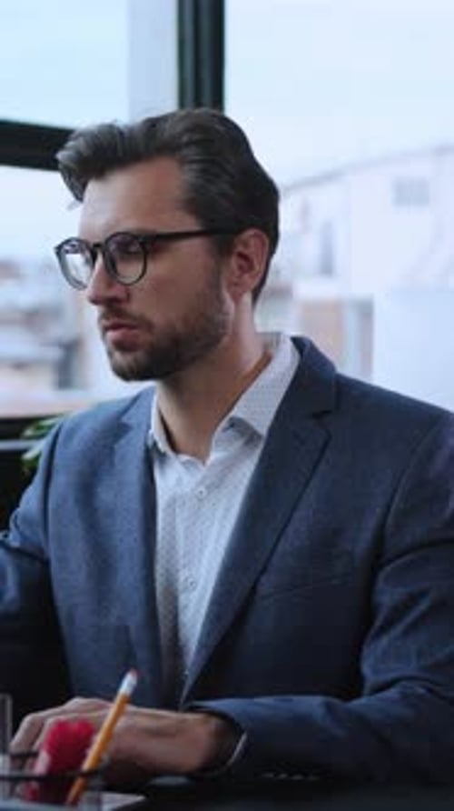 Dedicated and Focused Professional Engaged in Work on Computer in a Modern Office Environment