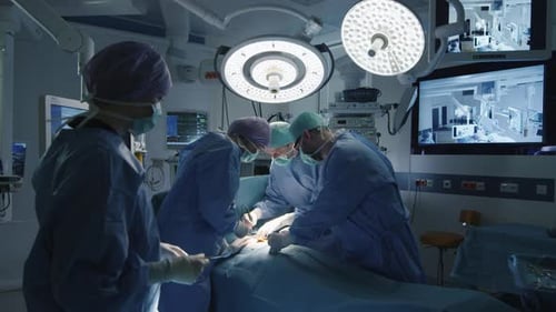 Surgeons Perform Operation in Brightly Lit Operating Room