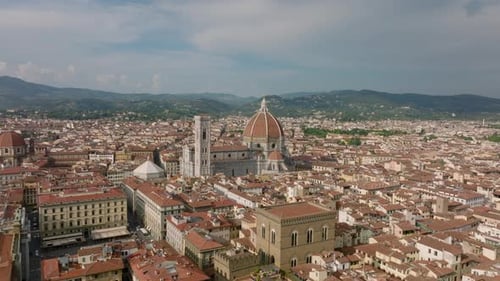 Aerial Cinematic Footage of Florence Cathedral with Tall Tower and Large Red Dome