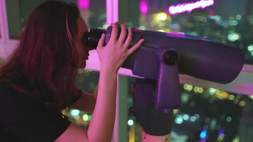 Woman Looking in Telescope at Night City