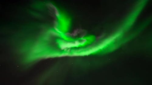 Real-time video of Northern Lights dancing in dark and starry sky, Norway