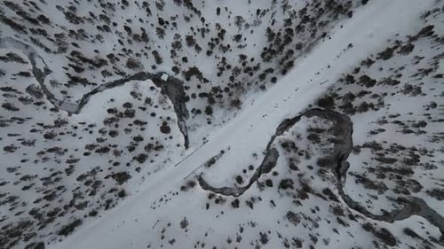 Aerial view of snowy road with river, Finland.