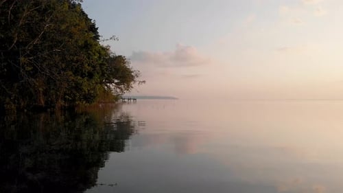 Drone aerial view of sunset at the lake Bacalar in Mexico