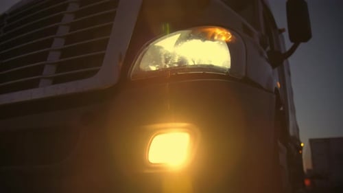 Illuminated Semi Truck Parked at Night