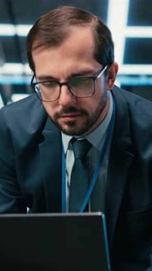 Vertical Video Data Center Admin Typing on Laptop Keyboard Doing Resource Optimization