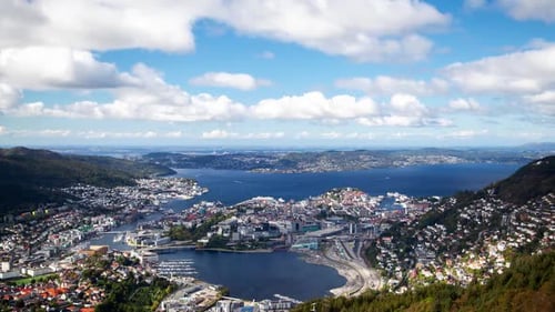 Bergen, Scandinavian City in the harbor between the mountains, skyline timelapse