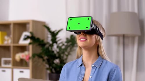 Woman wearing VR headset with chroma key screen