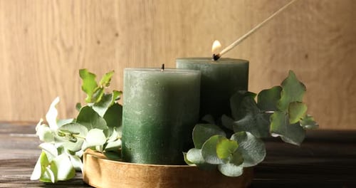 Burning Green Candles with Eucalyptus on Wood Tray