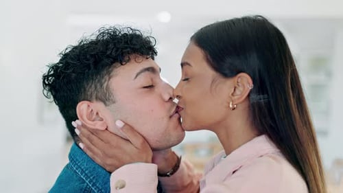 Loving Couple Sharing a Tender Kiss Indoors