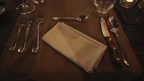 Elegant Table Setting with Silverware and Glassware