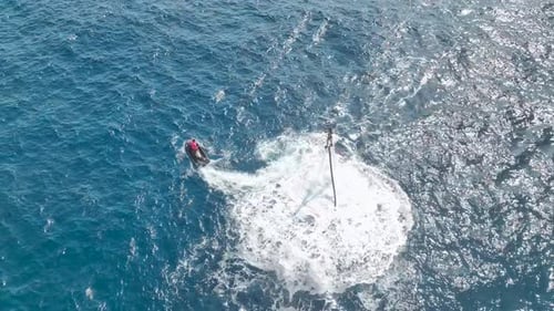Aerial View Surfing the Sky A Flyboard Fantasy Above Turquoise Waves