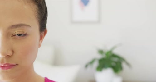 Smiling Young Woman Looks at Camera, Home Setting